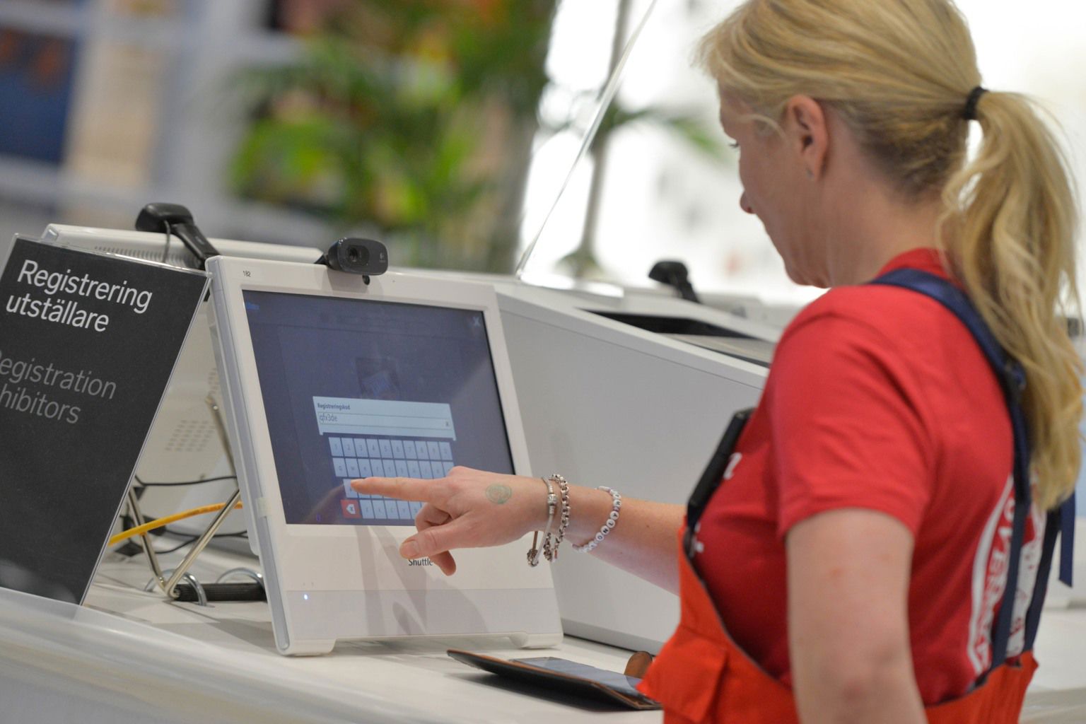 Woman typing on a screen.